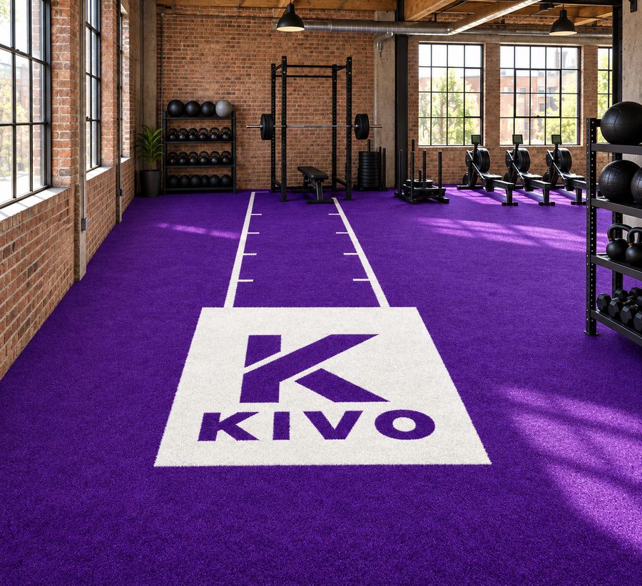 Purple custom turf in an industrial gym with KIVO branding